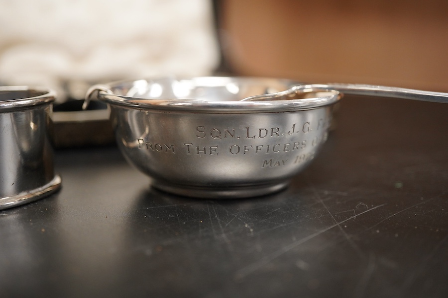 Two cased sets of six mid 20th century silver coffee spoons including Barker Brothers Silver Ltd, Birmingham, 1940, together with a silver and sterling napkin rings and a silver tea strainer on stand.